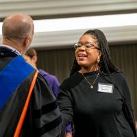 on stage to collect award